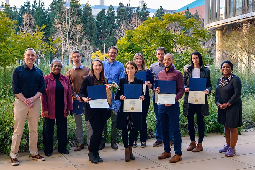 Grad student and postdoc mentoring award honorees pose for a photo with Grad Division Dean's Office staff at Mission Bay campus
